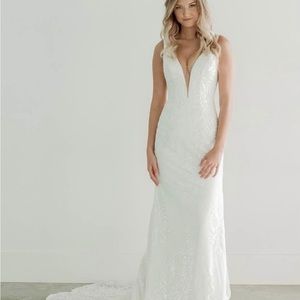 Never worn. Size 12 but fits a size 6. Brand new, tags are on it/ never altered